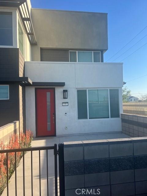 3620 S Allston Paseo Unit 7, Ontario, CA 91761 - view of front facade with stucco siding and fence