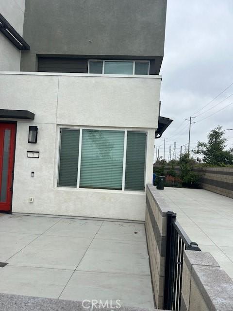 3620 S Allston Paseo Unit 7, Ontario, CA 91761 - exterior space featuring a balcony and stucco siding