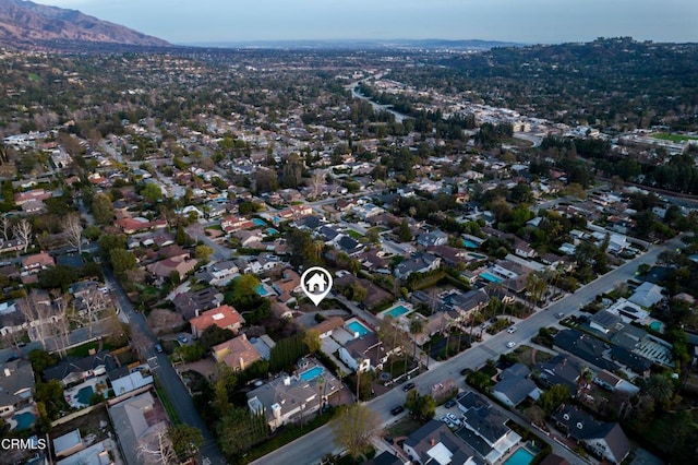 drone / aerial view featuring a mountain view