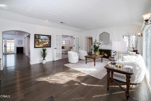 living room with french doors and dark hardwood / wood-style flooring