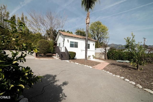 view of front of property with a mountain view