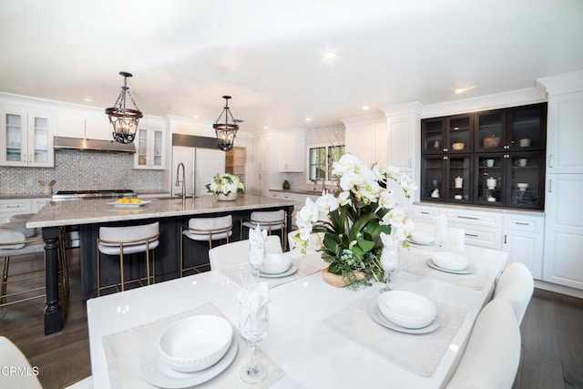 dining room featuring dark hardwood / wood-style flooring and sink