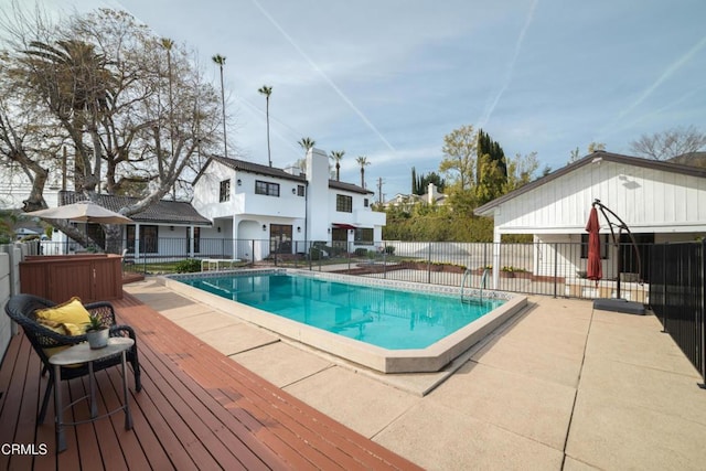 view of swimming pool featuring a deck