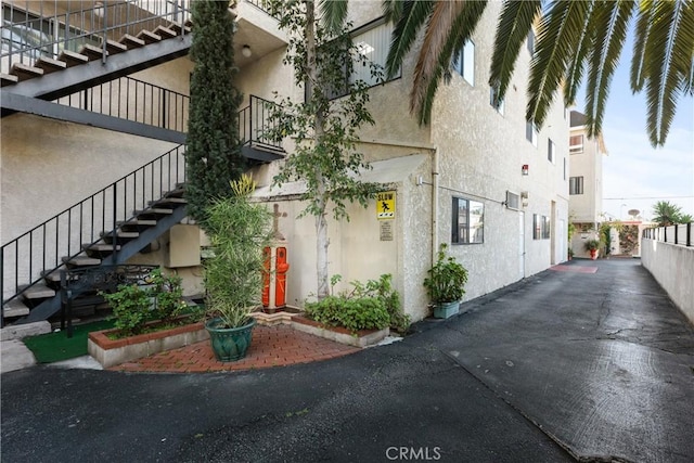 420 W Windsor Rd, Glendale, CA 91204 - view of home's exterior featuring stairway and stucco siding