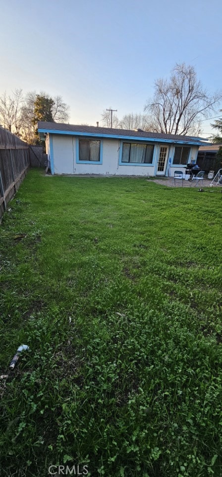 exterior space with a lawn and a patio