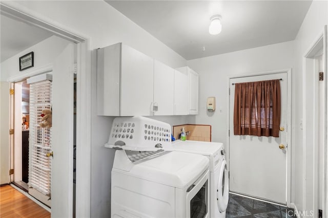 laundry room featuring washer and dryer and cabinet space