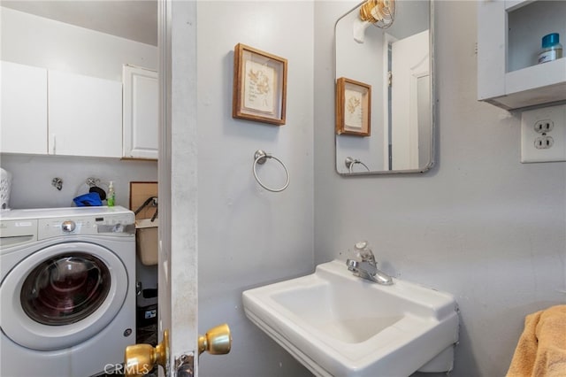 laundry area with sink and washer / dryer