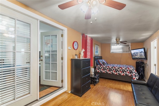 bedroom with light wood-style flooring and a ceiling fan