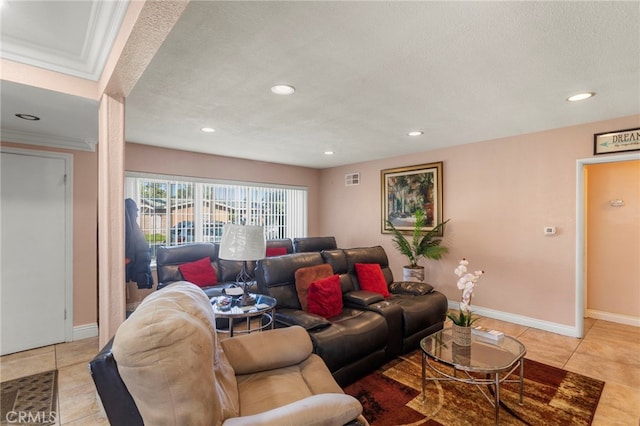 living room featuring ornamental molding, tile patterned floors, and a textured ceiling