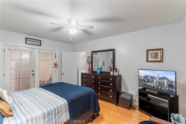 bedroom featuring access to exterior, light hardwood / wood-style flooring, and ceiling fan