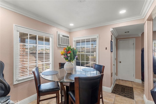 tiled dining space with crown molding and a wall mounted AC