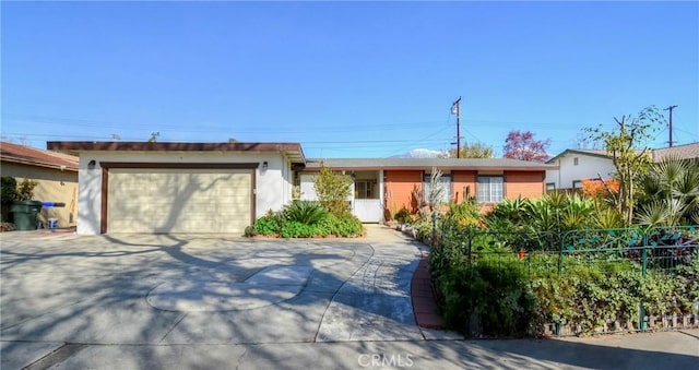 ranch-style home featuring a garage