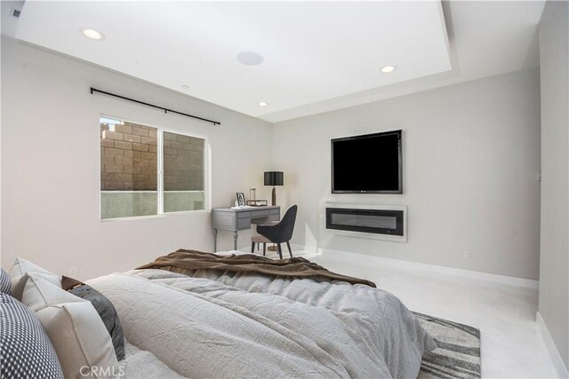 carpeted bedroom featuring baseboards and recessed lighting