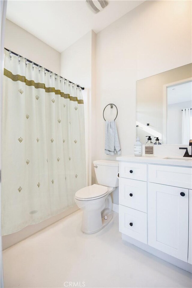 full bath with visible vents, curtained shower, toilet, vanity, and tile patterned flooring