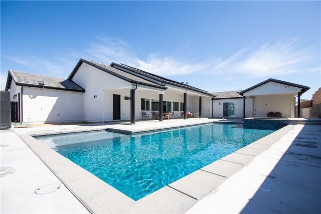 pool with a patio area