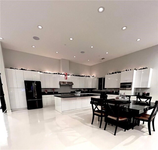 dining space featuring recessed lighting