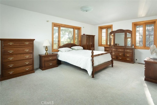 bedroom featuring light carpet