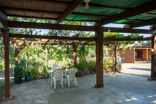 view of patio / terrace with outdoor dining area and a pergola