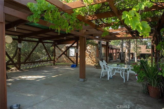 view of patio featuring outdoor dining area