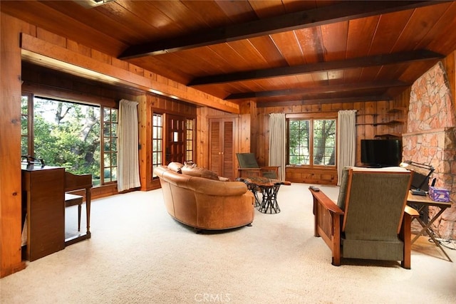 living room featuring light carpet and wooden walls