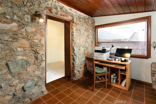 home office featuring dark tile patterned flooring, wood ceiling, and plenty of natural light