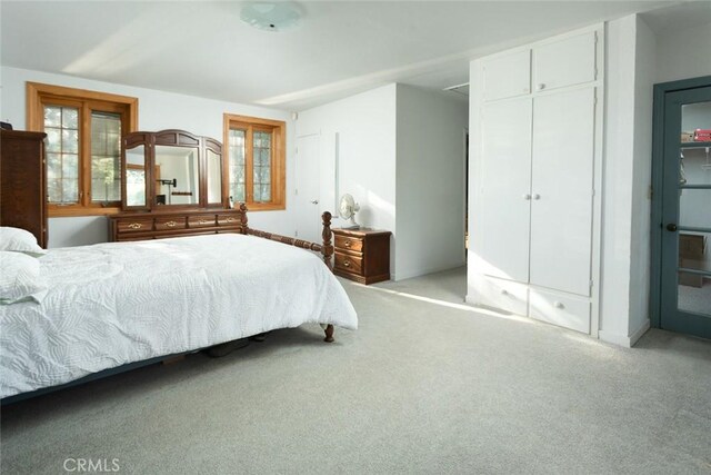 bedroom with light carpet