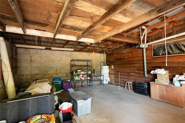 garage with concrete block wall