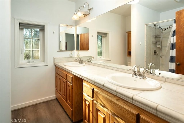 bathroom featuring a wealth of natural light and a sink