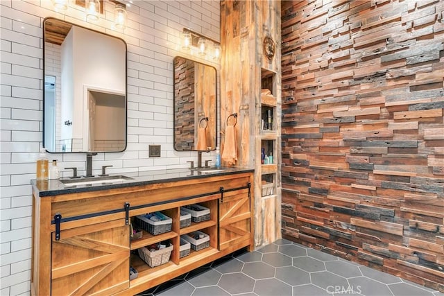 interior space featuring double vanity, tile patterned flooring, and a sink