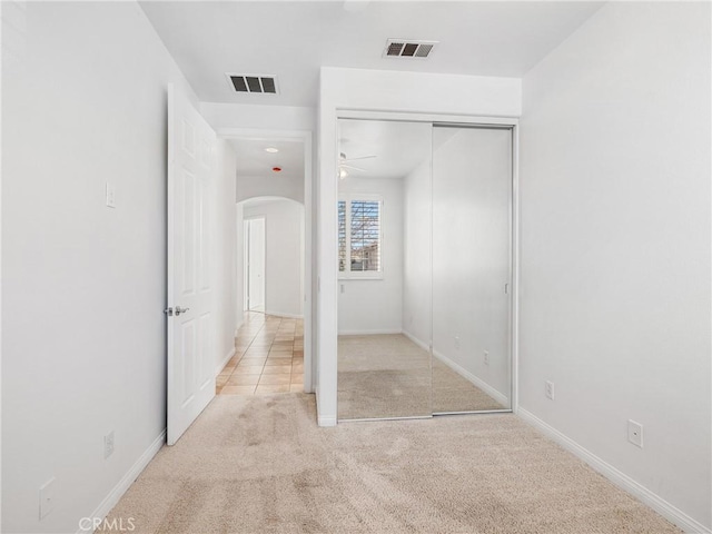 11175 Avonlea Rd, Apple Valley, CA 92308 - unfurnished bedroom with arched walkways, carpet floors, and a closet