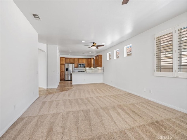 11175 Avonlea Rd, Apple Valley, CA 92308 - unfurnished living room featuring ceiling fan, light colored carpet, and recessed lighting
