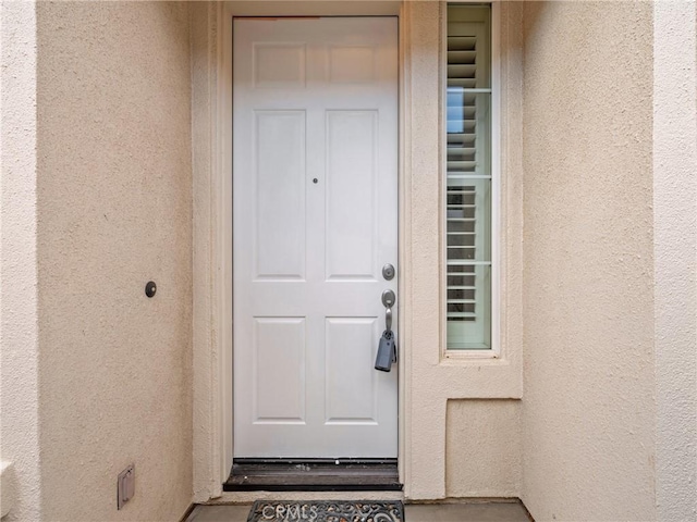 11175 Avonlea Rd, Apple Valley, CA 92308 - property entrance with stucco siding