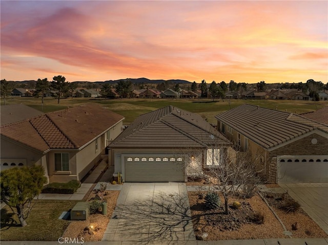 11175 Avonlea Rd, Apple Valley, CA 92308 - ranch-style house with an attached garage, concrete driveway, a residential view, and a tile roof