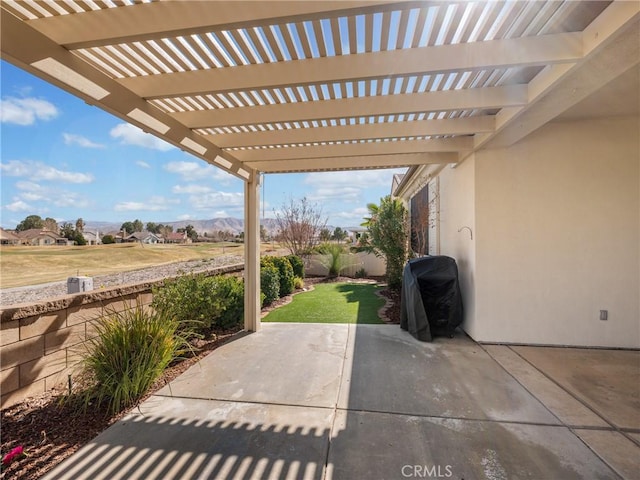 11175 Avonlea Rd, Apple Valley, CA 92308 - view of patio with area for grilling, a mountain view, and a pergola
