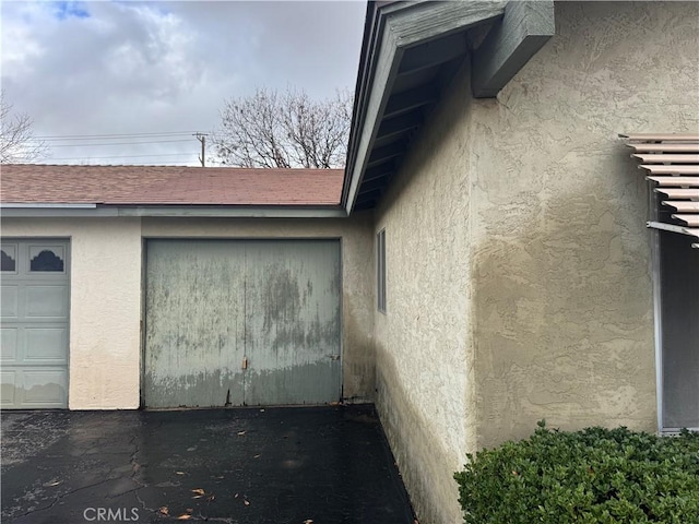 view of side of home featuring a garage