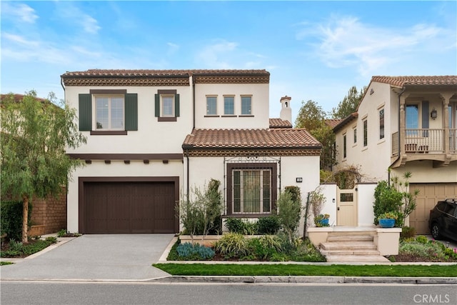 mediterranean / spanish house featuring a garage