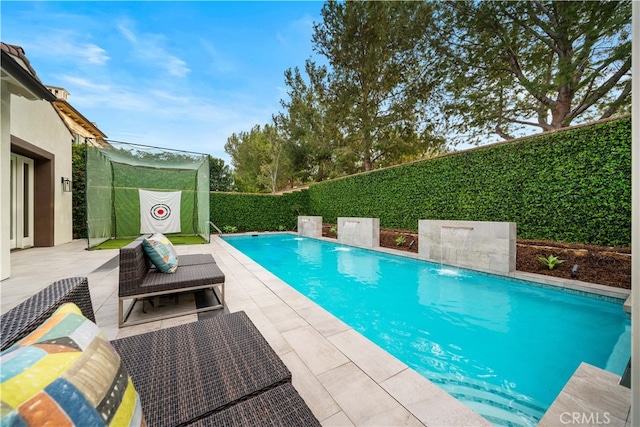 view of pool featuring a patio and pool water feature