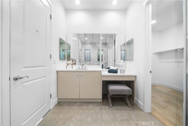 bathroom featuring vanity and a shower with shower door