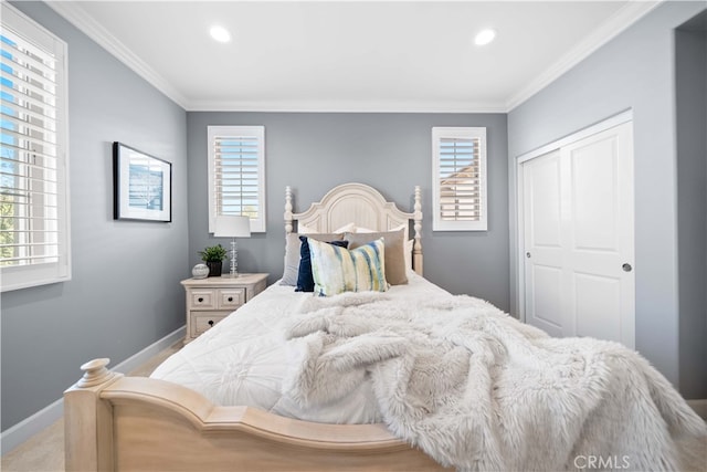 bedroom with ornamental molding and a closet