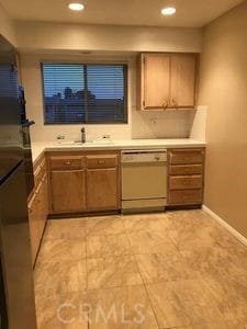 kitchen with white dishwasher and sink