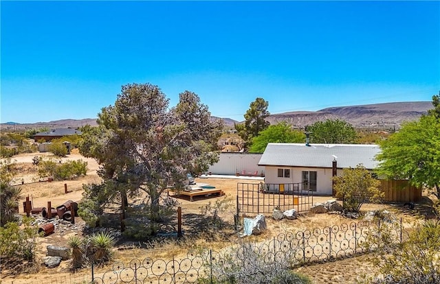 rear view of property with a mountain view