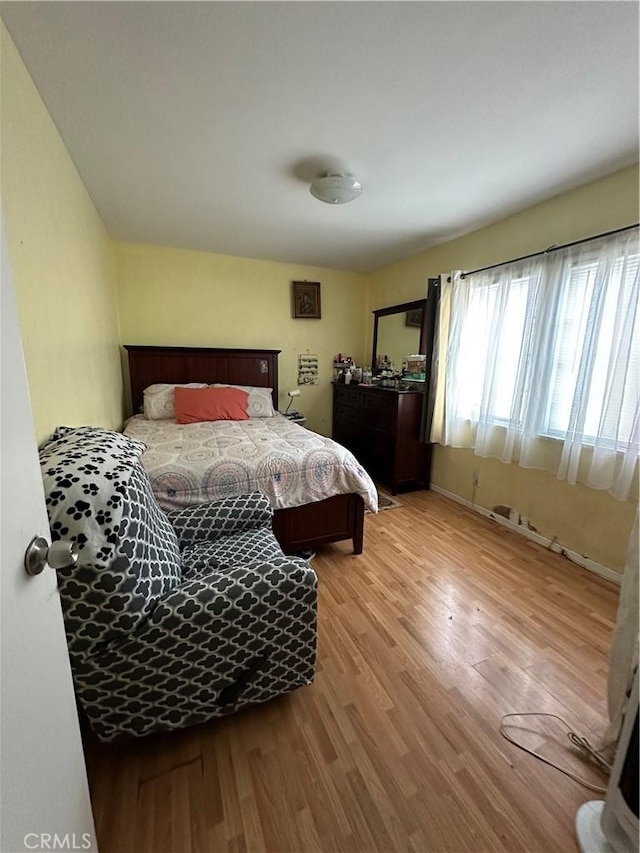 bedroom featuring light wood-type flooring