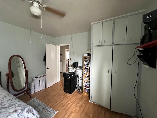 bedroom with ceiling fan and light wood-type flooring