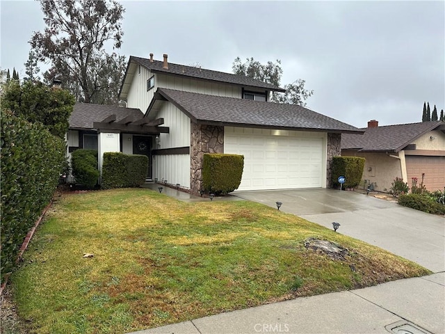 view of front of house with a garage and a front yard