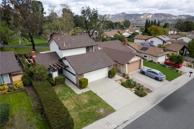 birds eye view of property featuring a mountain view and a residential view