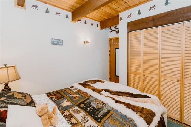 1971 Fern Ln, Big Bear City, CA 92314 - bedroom with beamed ceiling, a closet, and wooden ceiling