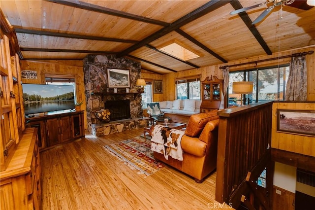 1971 Fern Ln, Big Bear City, CA 92314 - living room featuring lofted ceiling with skylight, wooden ceiling, wooden walls, and light hardwood / wood-style floors