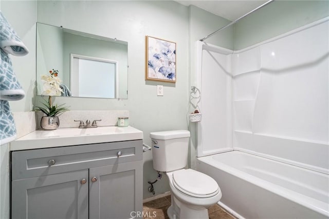 bathroom with toilet, shower / tub combination, and vanity