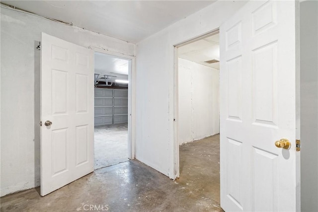 hallway featuring concrete flooring