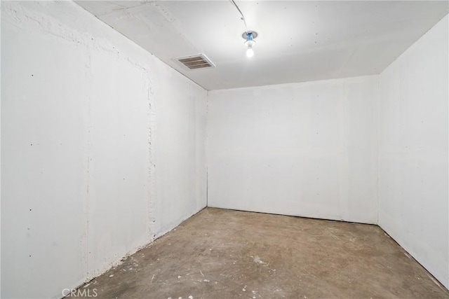 empty room featuring unfinished concrete floors and visible vents